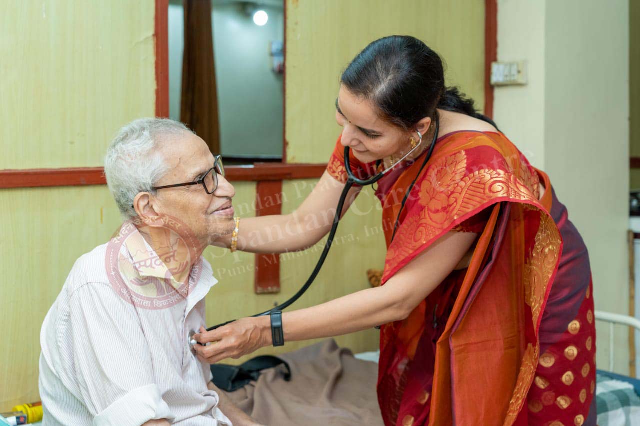 Healthcare professional examining an elderly patient
